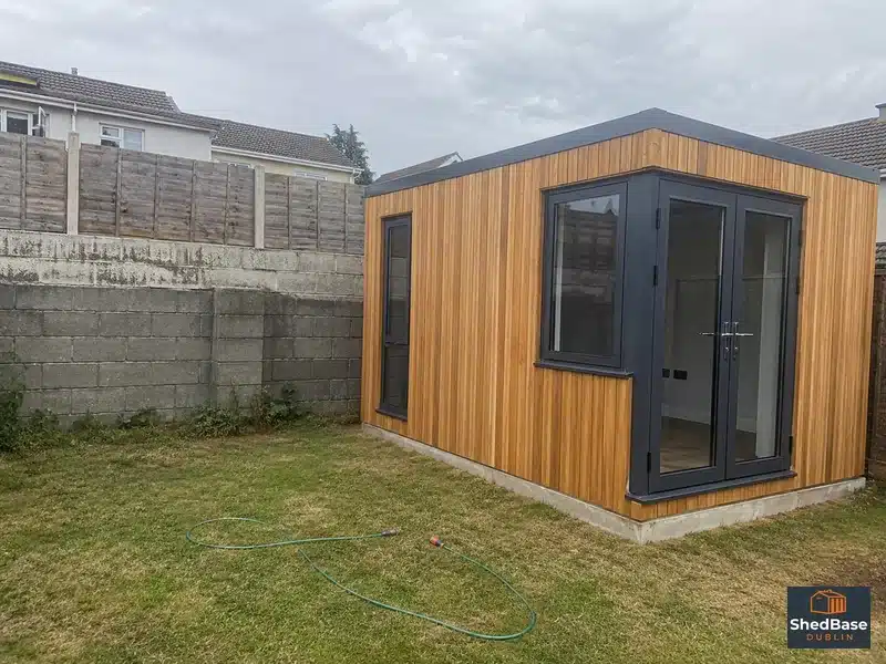 Timber clad garden room in a Dublin back garden sitting on a concrete base