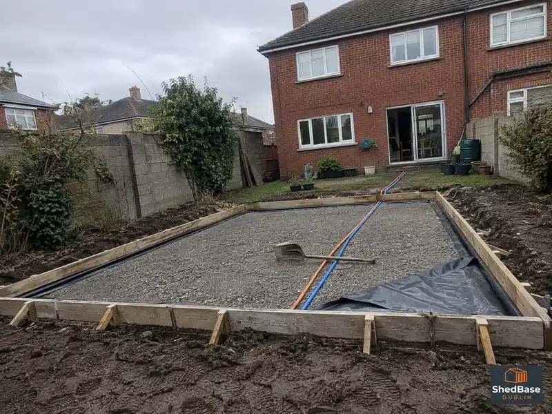 Water and electrical service ducts laid through a garden room base before the concrete pour in Dublin
